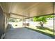 Covered patio featuring plenty of space, a hot tub and a fire pit at 11797 David Ct, Largo, FL 33778
