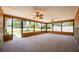 The large enclosed lanai features many large windows and lots of light at 11797 David Ct, Largo, FL 33778