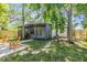Charming backyard with a screened patio, lush lawn, and a beautiful natural setting at 120 12Th N Ave, Safety Harbor, FL 34695
