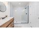 Modern bathroom featuring a glass-enclosed walk-in shower with black hardware and white tile at 120 12Th N Ave, Safety Harbor, FL 34695
