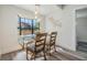 Bright dining room featuring a glass table set, lots of natural light, wood floors, and neutral paint at 120 12Th N Ave, Safety Harbor, FL 34695