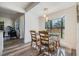 Bright dining room featuring a glass table set, lots of natural light, wood floors, and neutral paint at 120 12Th N Ave, Safety Harbor, FL 34695