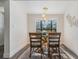 Bright dining room featuring a glass table set, lots of natural light, wood floors, and neutral paint at 120 12Th N Ave, Safety Harbor, FL 34695