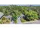 Charming single Gathering home with mature landscaping, a long driveway, and quaint curb appeal at 120 12Th N Ave, Safety Harbor, FL 34695