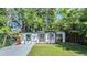 Charming single story home features a well manicured lawn, fresh landscaping, and neutral exterior at 120 12Th N Ave, Safety Harbor, FL 34695