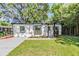 Charming single story home features a well manicured lawn, fresh landscaping, and neutral exterior at 120 12Th N Ave, Safety Harbor, FL 34695