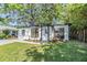 Charming single story home features a well manicured lawn, fresh landscaping, and neutral exterior at 120 12Th N Ave, Safety Harbor, FL 34695