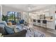 Inviting living room with views into dining and kitchen area features lots of natural light and wood floors at 120 12Th N Ave, Safety Harbor, FL 34695