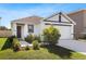Well-manicured lawn and landscaping highlight this charming single-Gathering home at 12168 Lily Magnolia Ln, Riverview, FL 33569
