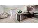 Open-concept living area flowing seamlessly into the kitchen at 12168 Lily Magnolia Ln, Riverview, FL 33569