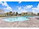 Community pool with lounge chairs and clear blue water in a neighborhood setting at 12168 Lily Magnolia Ln, Riverview, FL 33569