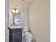 Elegant half bathroom features granite countertops, modern lighting, and a sleek vanity at 12206 Blue Pacific Dr, Riverview, FL 33579