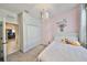 Cozy bedroom with pink walls, carpeted floors, and ample closet space at 12206 Blue Pacific Dr, Riverview, FL 33579