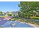 Charming home featuring a brick driveway, manicured lawn, and beautiful landscaping at 12206 Blue Pacific Dr, Riverview, FL 33579