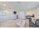 Upstairs bonus living room with cozy furniture, television, mini fridge, and workspace at 12206 Blue Pacific Dr, Riverview, FL 33579