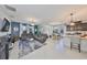 Open-concept living and dining area with modern furnishings and ample natural light at 12206 Blue Pacific Dr, Riverview, FL 33579