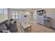 Upstairs bonus living room with cozy furniture, television, mini fridge, and workspace at 12206 Blue Pacific Dr, Riverview, FL 33579