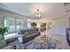 Spacious living room with a view to the patio, kitchen, and a staircase, perfect for entertaining guests at 12206 Blue Pacific Dr, Riverview, FL 33579
