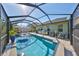 This sparkling blue screened-in pool offers plenty of space for outdoor fun and relaxation at 12206 Blue Pacific Dr, Riverview, FL 33579