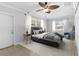 Comfortable bedroom features neutral walls, and a large window with natural light at 170 Argus Rd, Venice, FL 34293