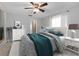 Comfortable bedroom with elegant decor, featuring a soft bed, dresser, and a stylish mirror at 170 Argus Rd, Venice, FL 34293
