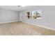 Bright living room featuring neutral paint, tile flooring, and large windows allowing natural light at 170 Argus Rd, Venice, FL 34293