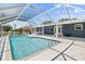 Backyard pool with screened enclosure, steps and clear blue water at 170 Argus Rd, Venice, FL 34293