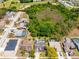 Birds-eye view of homes in quiet suburban neighborhood, complete with lush landscaping at 18836 Green Park Rd, Hudson, FL 34667