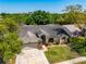 Charming single-story home features a well-maintained lawn, tiled roof, and attached two-car garage at 18836 Green Park Rd, Hudson, FL 34667