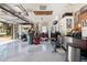 Spacious garage with epoxy flooring provides ample storage and organization with installed cabinets and pegboard at 18836 Green Park Rd, Hudson, FL 34667