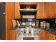 Gourmet kitchen features a stainless steel range and granite counters, perfect for cooking at 18836 Green Park Rd, Hudson, FL 34667