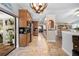 Spacious eat-in kitchen showcases wood cabinetry, granite counters, stainless steel appliances at 18836 Green Park Rd, Hudson, FL 34667