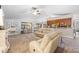 Open-concept living room features neutral tones, ceiling fan and plenty of natural light at 18836 Green Park Rd, Hudson, FL 34667