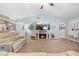 Bright living room with vaulted ceilings, fireplace, stylish decor, and comfortable furnishings at 18836 Green Park Rd, Hudson, FL 34667