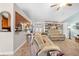 Open-concept living room boasts recessed lighting, ceiling fan and access to other rooms at 18836 Green Park Rd, Hudson, FL 34667
