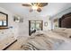 Spacious main bedroom with a large bed, sliding glass doors and a ceiling fan at 18836 Green Park Rd, Hudson, FL 34667