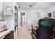Home office boasts neutral colors, built-in shelving, and a direct hallway view, providing a bright, functional workspace at 18836 Green Park Rd, Hudson, FL 34667