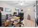 Spacious office with a glass top desk, executive chair, and ample workspace at 18836 Green Park Rd, Hudson, FL 34667