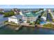 Stunning aerial view showcasing waterfront condos, private boat docks, and convenient access to the intercoastal waterway at 19817 Gulf Blvd # 602, Indian Shores, FL 33785