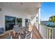 The covered balcony provides a relaxing space to enjoy water views and outdoor dining at 19817 Gulf Blvd # 602, Indian Shores, FL 33785