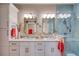 Stylish bathroom with double sinks, marble countertops, modern lighting, and a glass-enclosed shower, offering luxury at 19817 Gulf Blvd # 602, Indian Shores, FL 33785