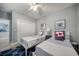 Charming bedroom featuring twin beds with nautical decor and a ceiling fan at 19817 Gulf Blvd # 602, Indian Shores, FL 33785