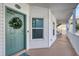 Inviting condo entrance with a charming wreath and well-maintained exterior at 19817 Gulf Blvd # 602, Indian Shores, FL 33785