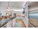 Bright kitchen featuring white cabinets, stainless steel appliances, and a central island at 19817 Gulf Blvd # 602, Indian Shores, FL 33785