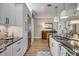 Contemporary kitchen with stainless steel refrigerator, granite countertops, and modern cabinetry at 19817 Gulf Blvd # 602, Indian Shores, FL 33785