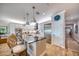 Modern kitchen featuring granite countertops, stainless steel appliances, island, and wooden floors at 19817 Gulf Blvd # 602, Indian Shores, FL 33785