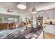 Open-concept kitchen with granite countertops, stainless steel appliances, and an island with bar seating at 19817 Gulf Blvd # 602, Indian Shores, FL 33785