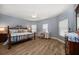 Spacious main bedroom with a king bed, a ceiling fan, and a writing desk, creating a serene retreat at 19817 Gulf Blvd # 602, Indian Shores, FL 33785