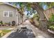 Outdoor workout area on the side of house with tree shade and work out mat at 2224 Gordon St, Tampa, FL 33605