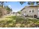 Spacious backyard featuring lush green grass, offering ample space for outdoor enjoyment and potential landscaping opportunities at 2224 Gordon St, Tampa, FL 33605